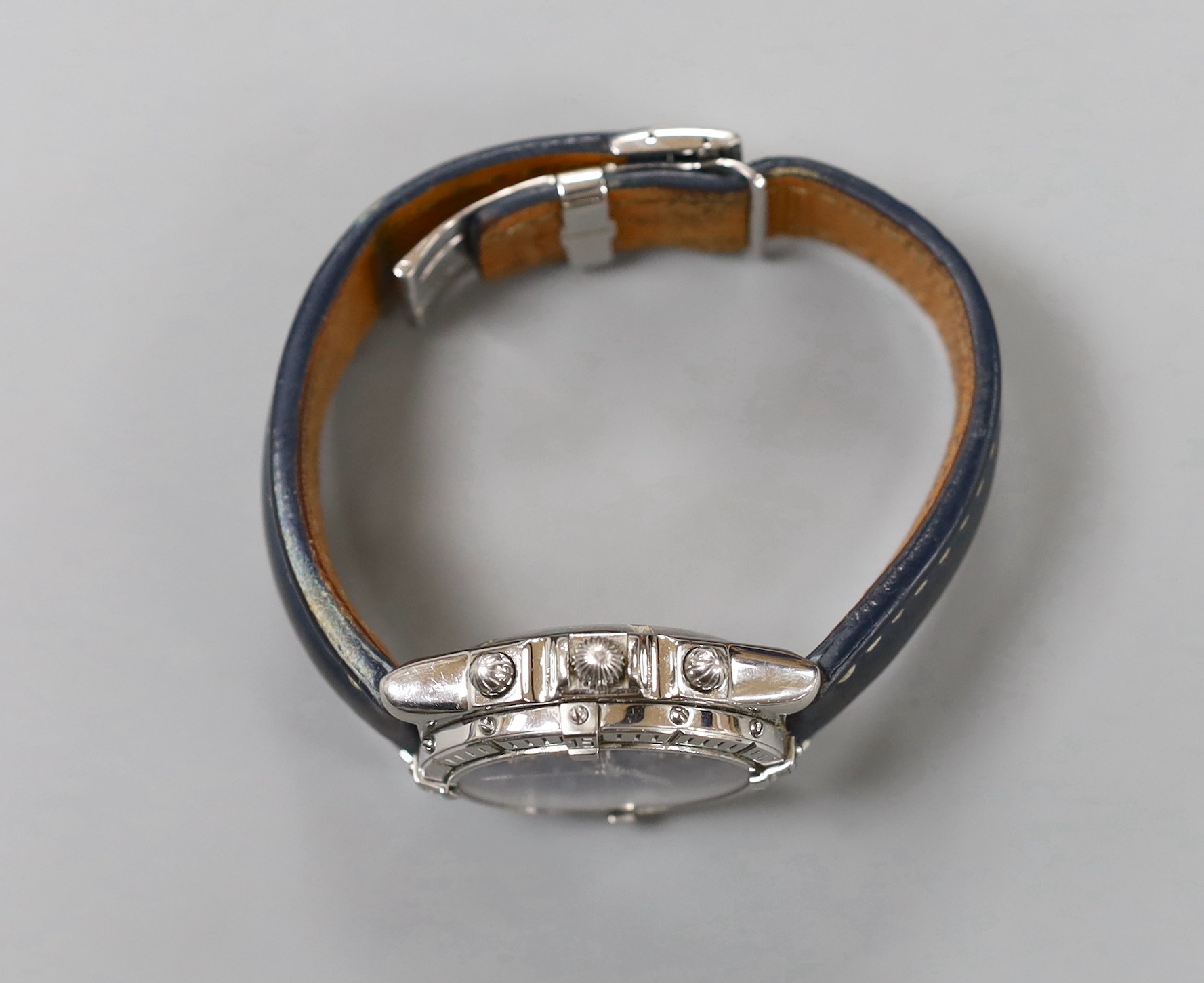 A gentleman's modern stainless steel Breitling chronograph automatic wrist watch, with blue Roman dial, on leather strap with deployment clasp, no box or papers.